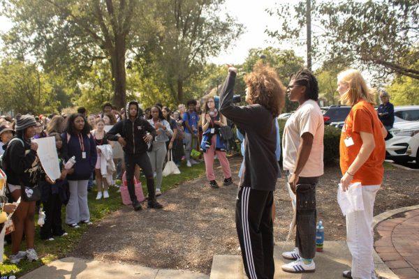 Juniors Gavin Marston, Zoie Durham and Nora Kaelber, who organized the effort, address students. Marston    voiced his grievances with gun legislation during today's walkout in protest of gun violence. 