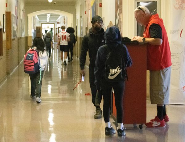 Dean of Students Greg Zannelli patrols the halls with his tardy cart, ready to hand out late passes.