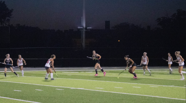 Junior field hockey captain Zoie Garnett works the ball up the field Sept. 12 at Russell H. Rupp stadium. 