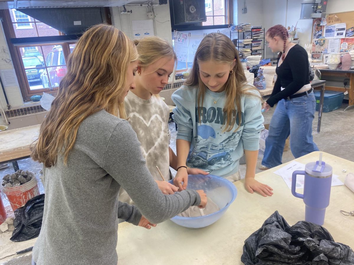 Juniors Nina Yacovone and Noa Hollander, and senior Taylor Boland craft in ninth period Ceramics class.