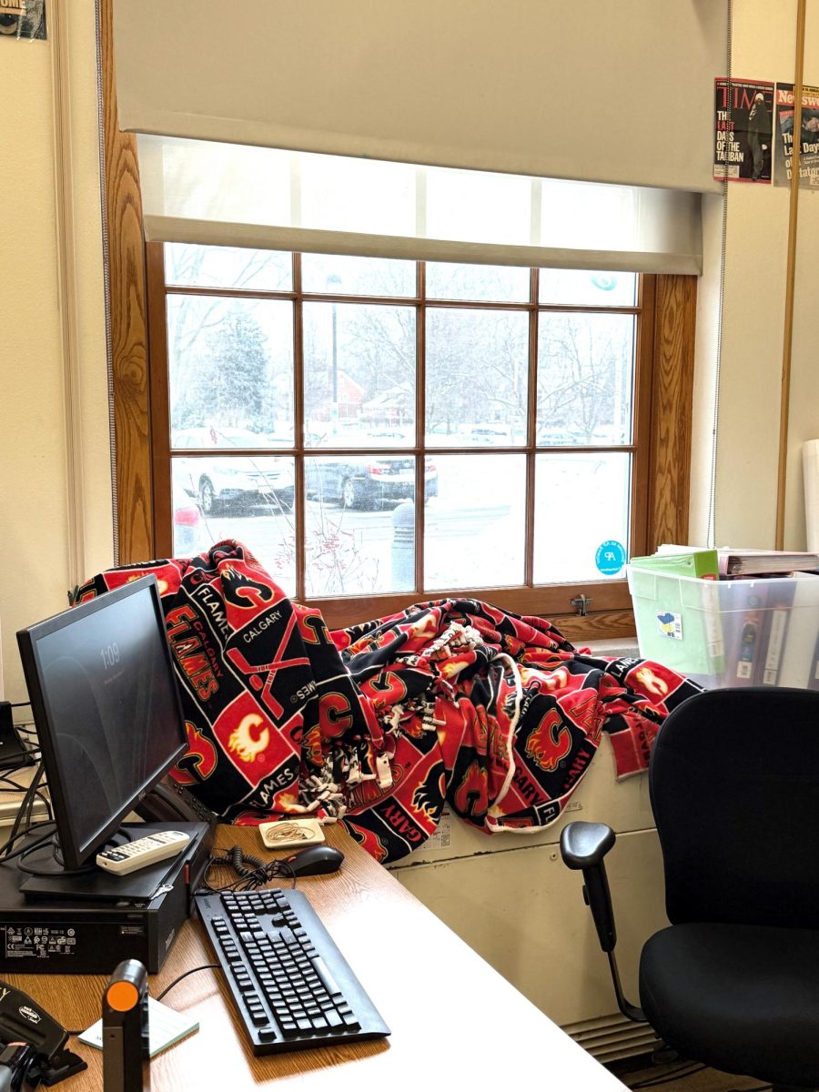 English teacher Aimee Grey draped a blanket over the heating unit in Room 161 in an effort to stem cold air that was entering from outside.