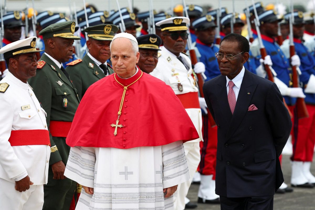 Pope Leo XIV walks next to President of Equatorial Guinea Teodoro Obiang Nguema Mbasogo upon his arrival at Malabo International Airport to begin his apostolic journey to Equatorial Guinea, in Malabo, Equatorial Guinea, April 21. REUTERS/Guglielmo Mangiapane